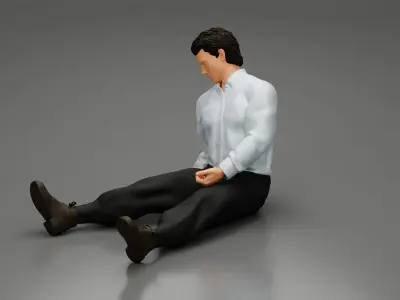 Accident of a male worker sitting on the floor with an injured 3D print model