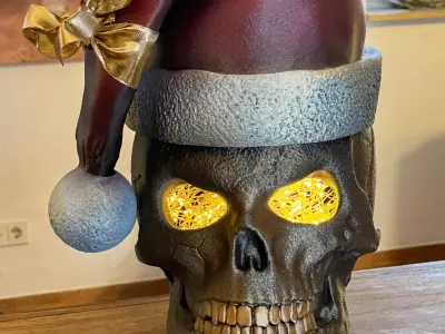 Skull with open eyes  Christmas hat and hollow inside 3D print model