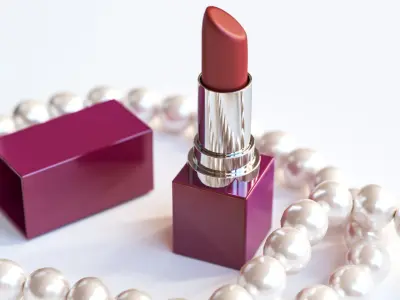 A bottle of champagne with glass next to pearls and red lipstick 3D model