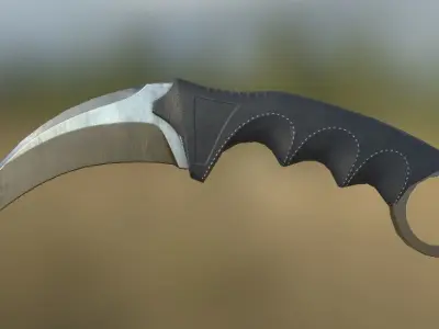 Karambit knife on grassy field Low-poly 3D model