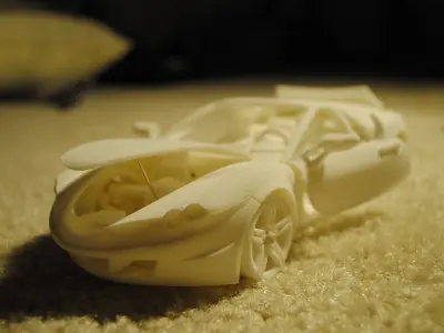 3D printable car with movable doors hoods steering wheel and ... Free 3D print model