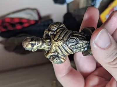 The engineer person holding brass figurine 3D print model