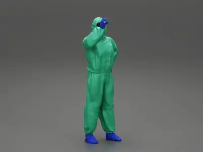 man wearing antivirus suit standing and holding 3D print model
