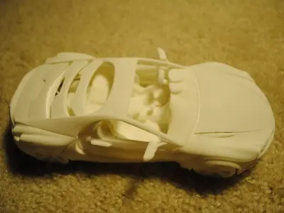 3D printable car with movable doors hoods steering wheel and ... Free 3D print model