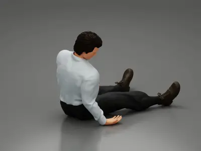 Accident of a male worker sitting on the floor with an injured 3D print model