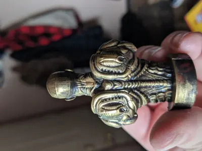 The engineer person holding brass figurine 3D print model