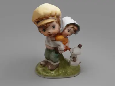 Figurine of boy and girl 3D model