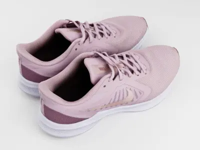 Pair of running womans shoes Nike pink sneakers sport  3D model