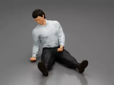 Accident of a male worker sitting on the floor with an injured 3D print model
