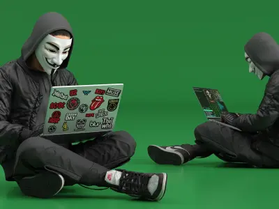  Hacker in Anonymous Mask Sitting Pose 
