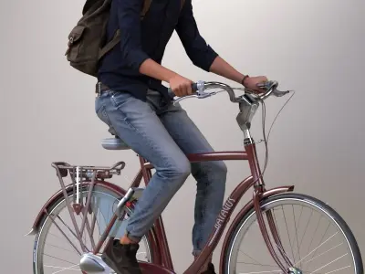 Pre-posed man on a bicycle with realistic hair 3D model