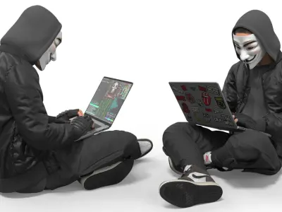  Hacker in Anonymous Mask Sitting Pose 