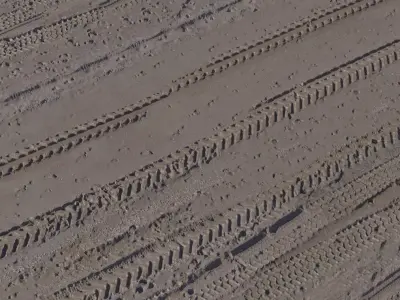 Vehicle Tire Tracks on Wet Dirt  Texture