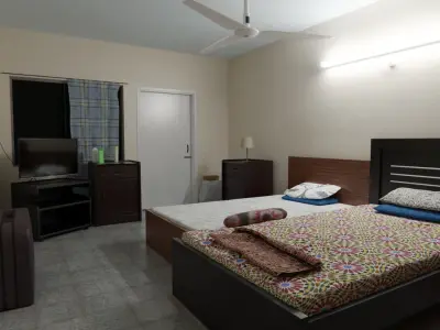 Bedroom with two beds and television 3D model