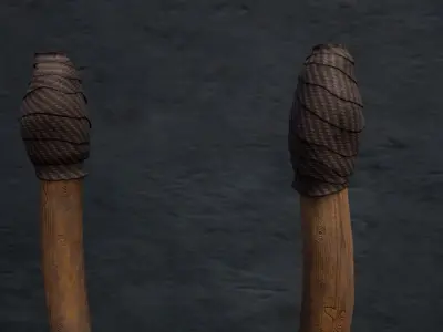 Torch wooden spear in middle of grassy field Low-poly 3D model