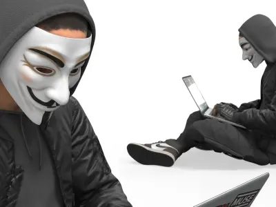  Hacker in Anonymous Mask Sitting Pose 