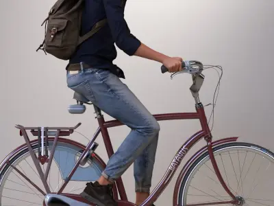 Pre-posed man on a bicycle with realistic hair 3D model