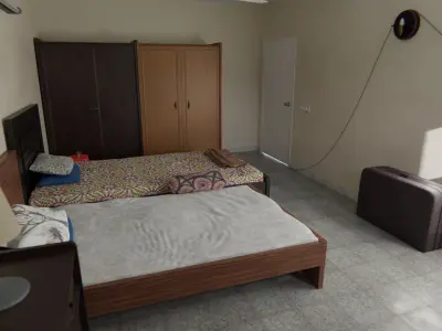 Bedroom with two beds and television 3D model