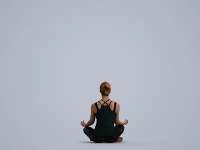 a woman sitting in the middle of a yoga pose 3D model