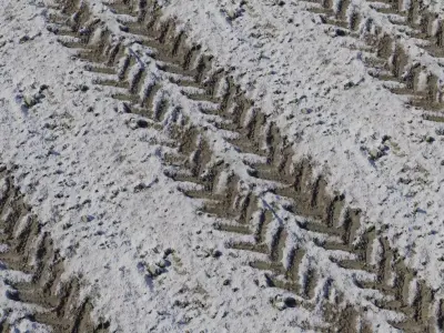 Snowy Dirt Road with Chevron Tire Tracks Texture