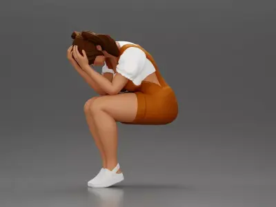 Crying girl sitting low in orange dress with head in hands 3D print model