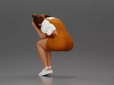 Crying girl sitting low in orange dress with head in hands 3D print model