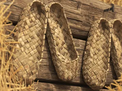 Aged Bast Shoes Hanging on Old Timber 3D model