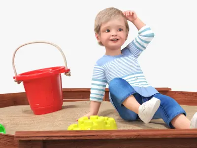  Small Child Playing in a Sandbox 