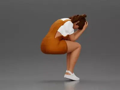Crying girl sitting low in orange dress with head in hands 3D print model