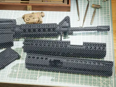 ANPEQ15 three military devices on cutting mat Low-poly 3D model