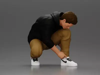 Man in hoodie crouching down tying shoelaces focused 3D print model
