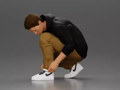 Man in hoodie crouching down tying shoelaces focused 3D print model