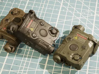 ANPEQ15 three military devices on cutting mat Low-poly 3D model