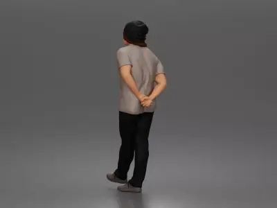 Relaxed young man in beanie standing casually with hands behind 3D print model