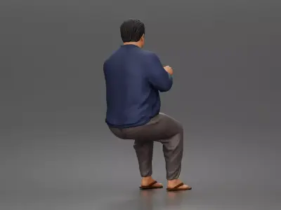 Asian Man sits gesturing while wearing casual sweater pants 3D print model