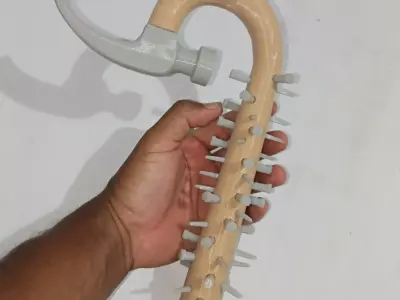 Curved hammer full of nails 3D print model