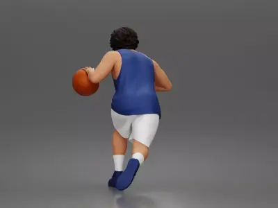 Basketball player drives forward dribbling ball wearing jersey 3D print model
