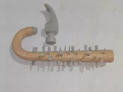 Curved hammer full of nails 3D print model