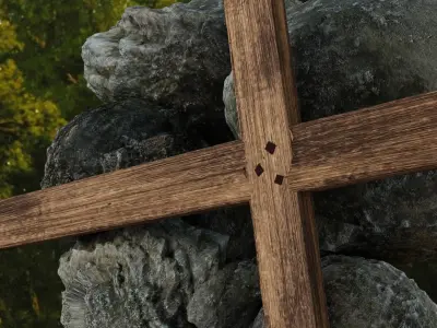 Simple wooden cross on top of boulders Free 3D model