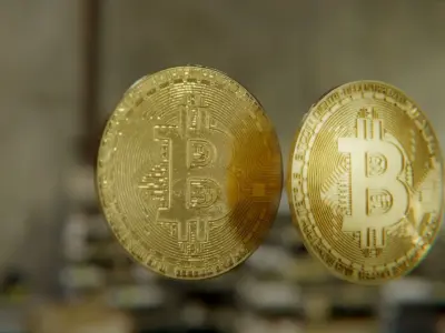 Bitcoin two gold bitcoins on table Low-poly 3D model