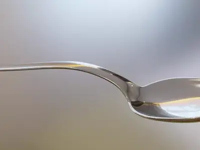 Spoon silver on table Free 3D model