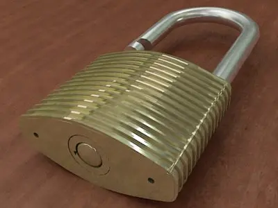 Padlock gold on wooden table 3D model