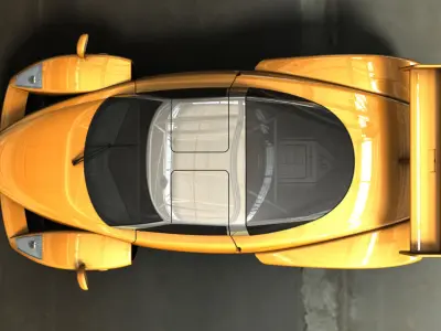 LeMansASGTV8 orange sports car parked in parking lot Free 3D model