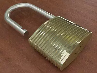 Padlock gold on wooden table 3D model